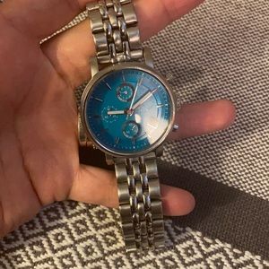 Silver fossil watch with blue face